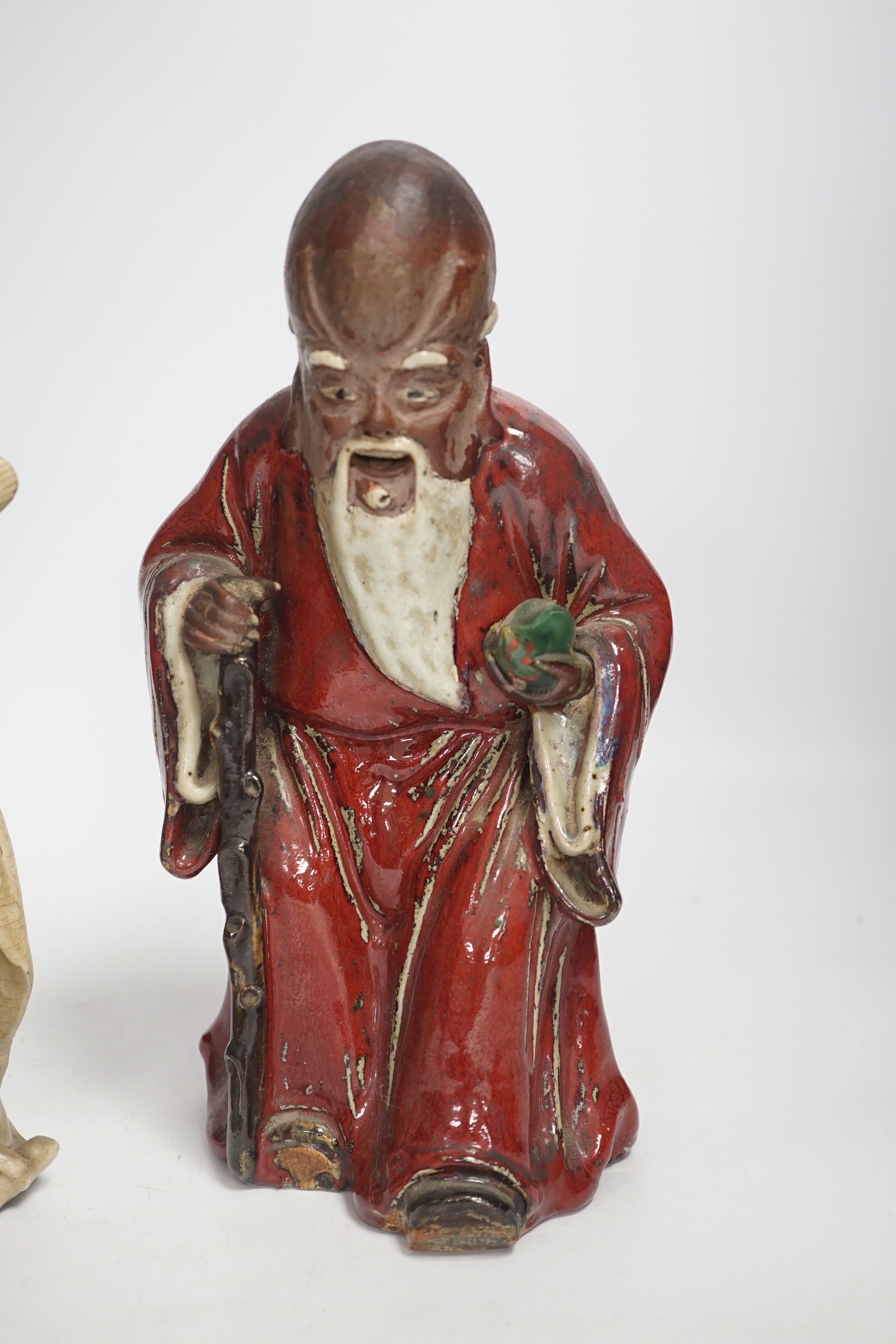 Two Chinese Shiwan pottery figures, largest 27cm high